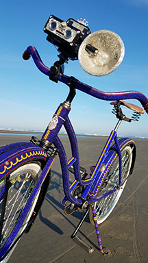 On the beach with a beaded bike I call CyClick, with the beaded Coronet attached the handlebars.